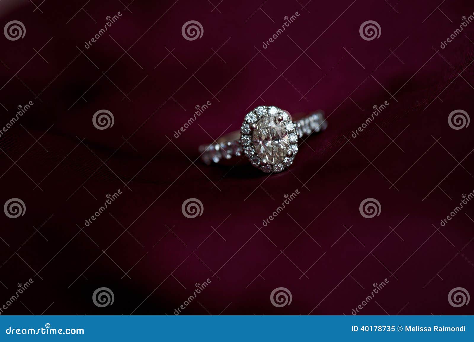 diamond engagement ring on red