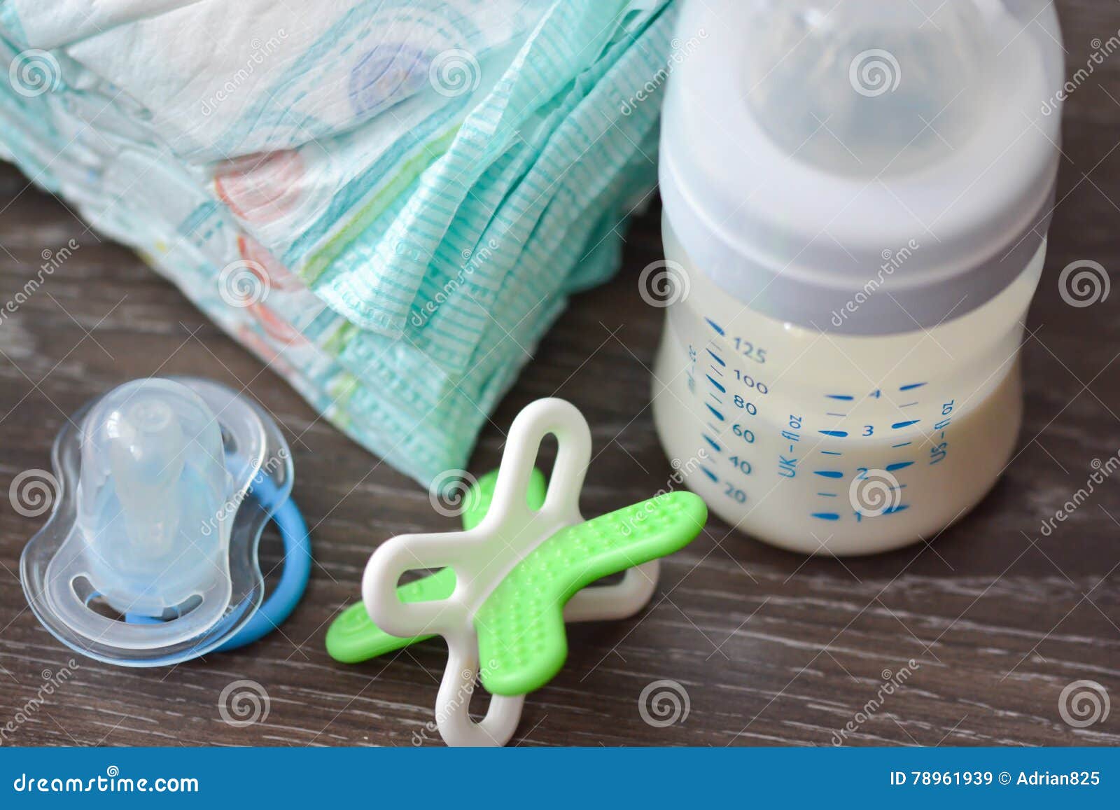 Diapers, Milk Bottle and a Pacifier Stock Image - Image of child, baby ...