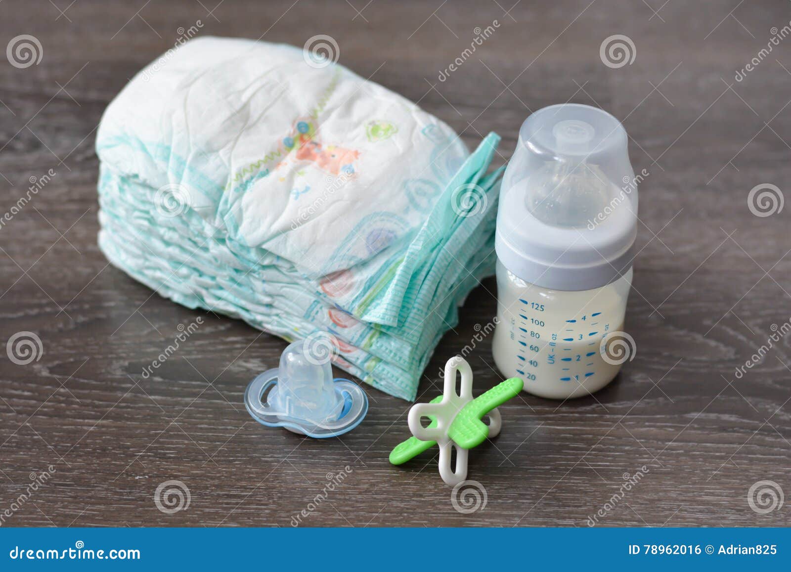 Diapers, Milk Bottle and a Pacifier Stock Photo - Image of learning ...