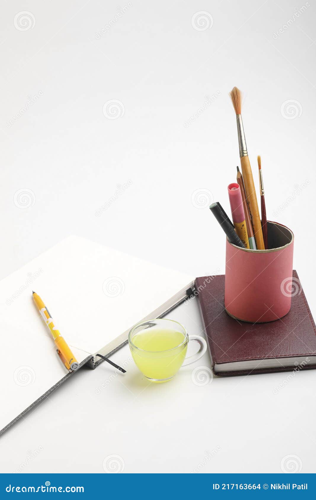 Diary and Pen with Cup of Green Tea. Work from Home Concept Stock Photo