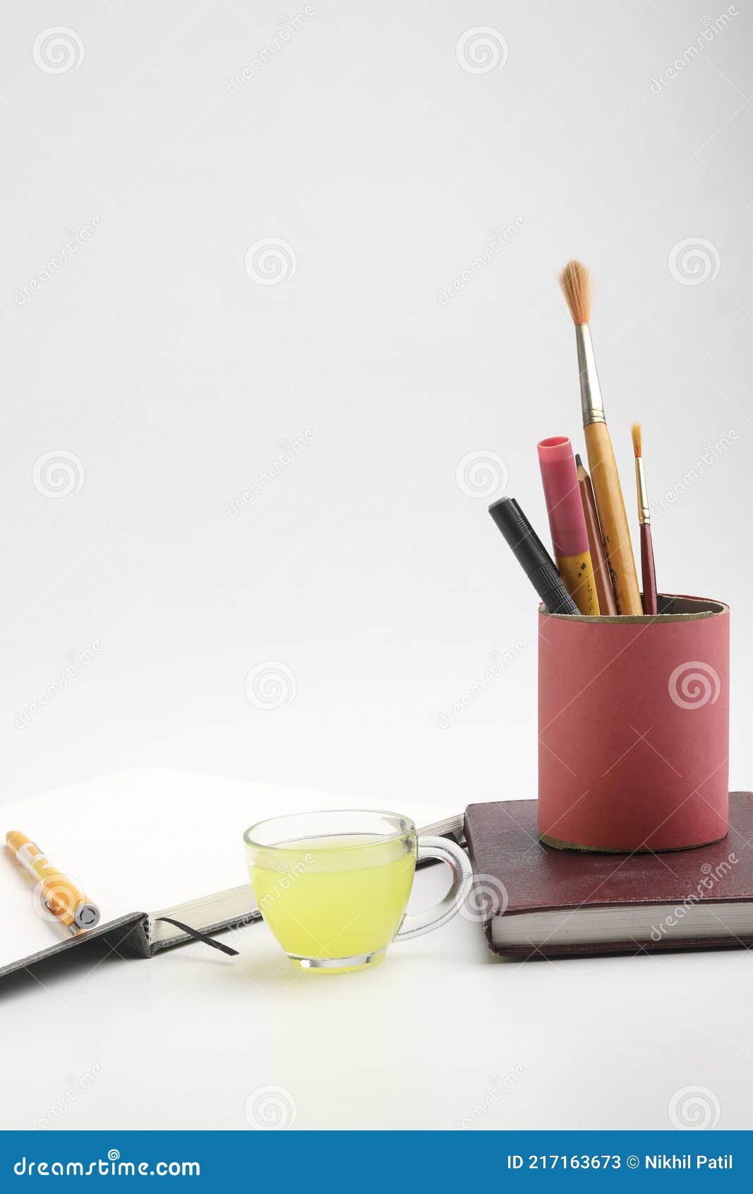 Diary and Pen with Cup of Green Tea. Work from Home Concept Stock Image