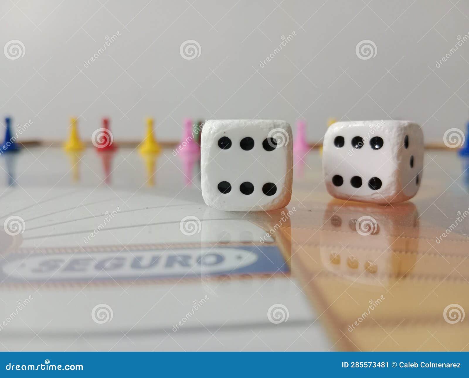 dice on the board and park tokens in the background