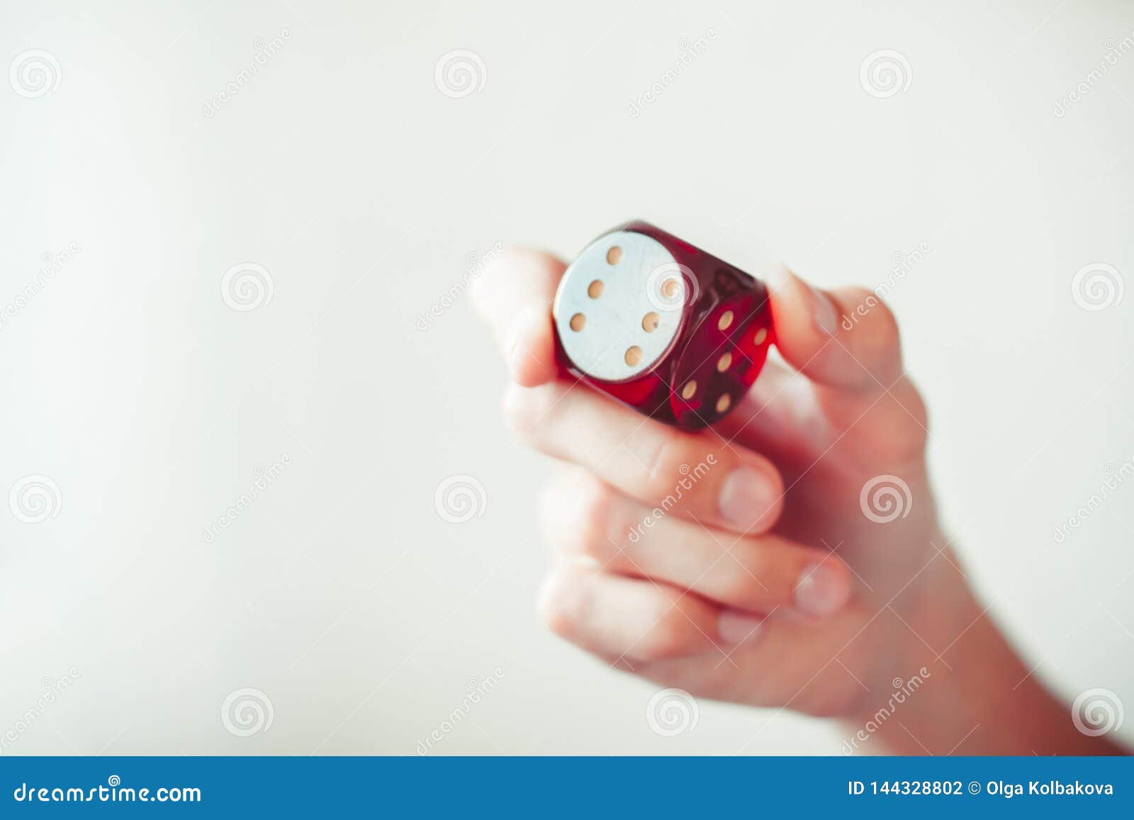Dice for games in hand stock photo. Image of cloth, leisure 144328802