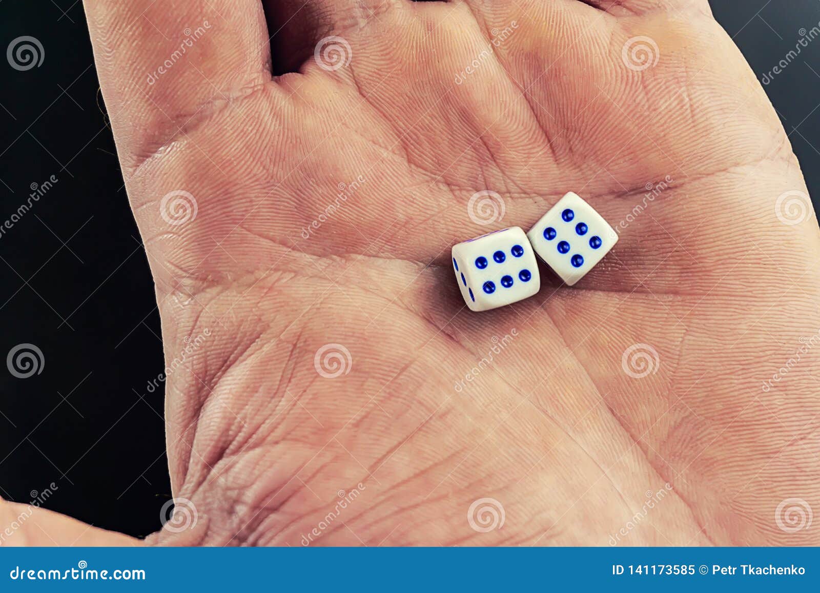 Dice in a man`s hand stock image. Image of hippodrome 141173585
