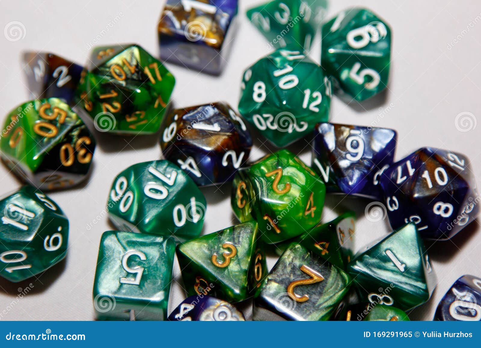 dices for board games, dnd and rpg scattered on light surface