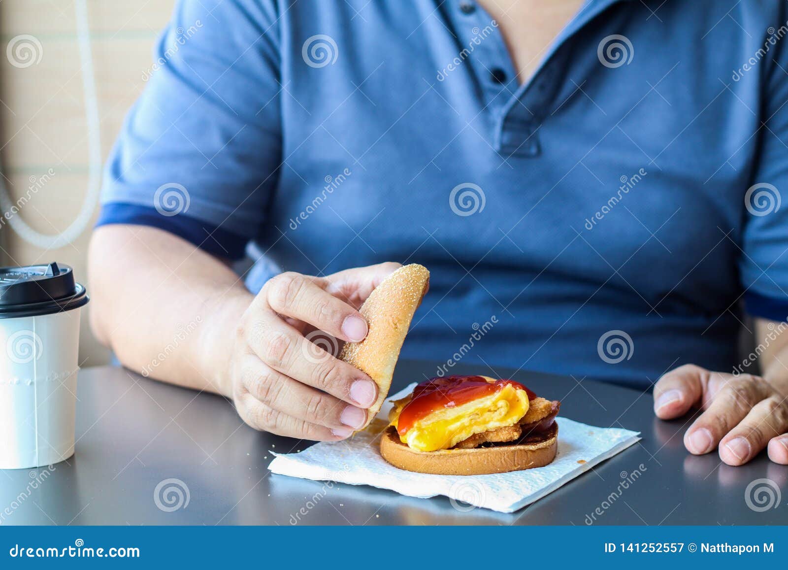 diet failure of fat man eating fast food hamberger. happy smile overweight person . hate to diets. very fat man eating fast food,