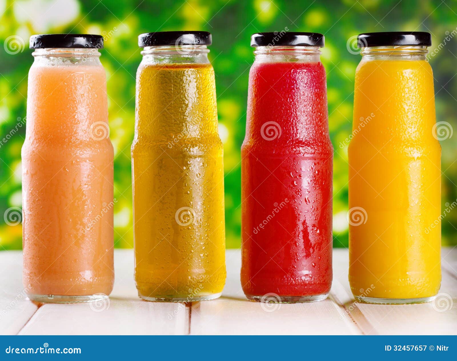 Different bottles of juice stock image. Image of grapefruit 32457657