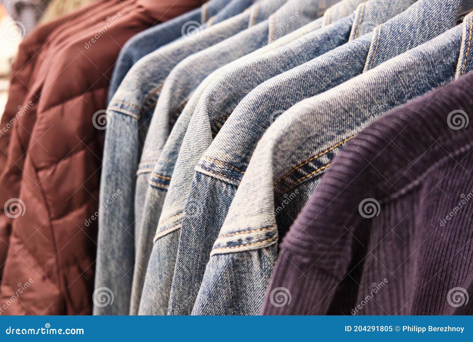Different Casual Men Shirts Hang on Hanger Racks at Store Stock Image