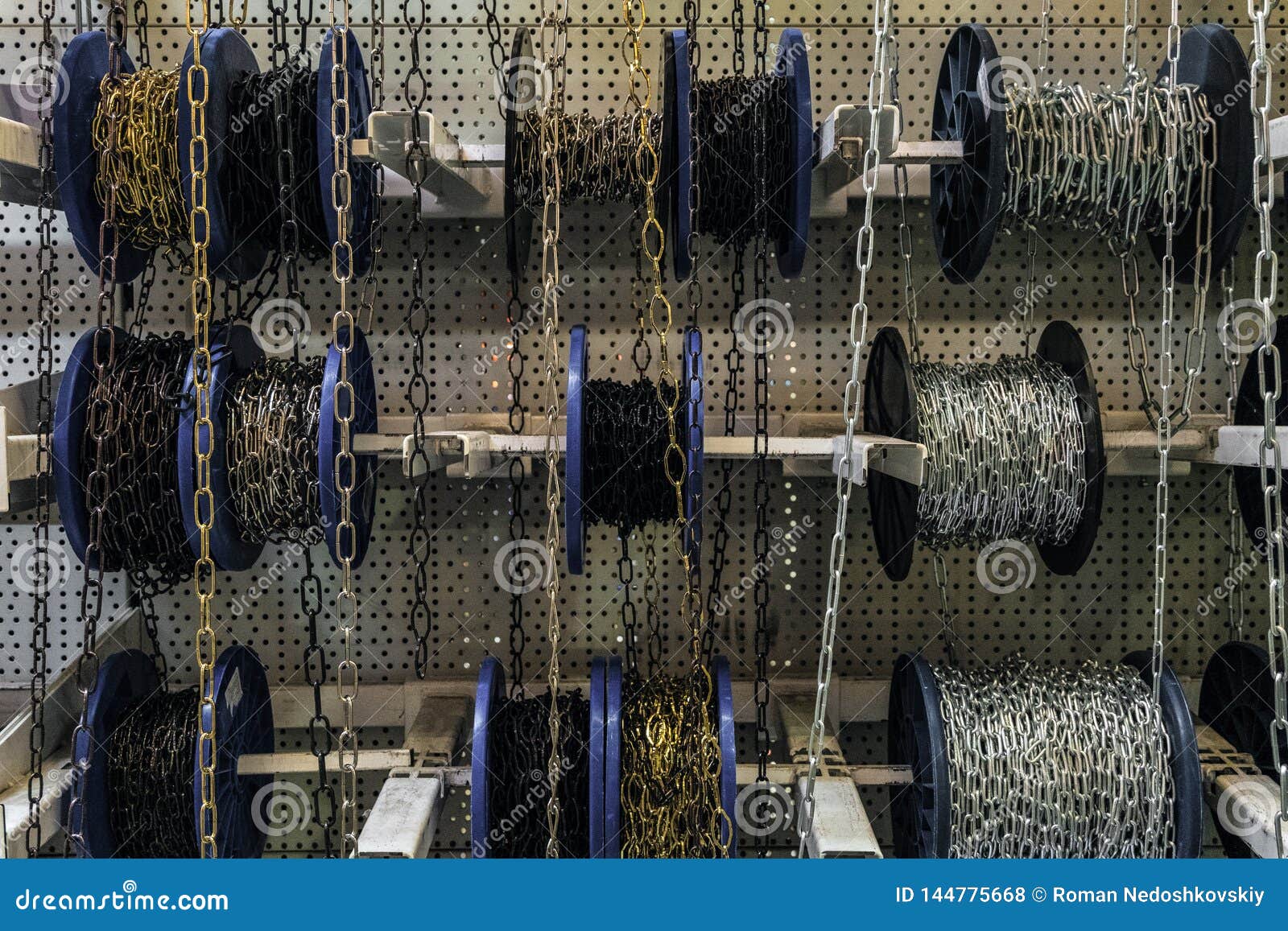 Different Chains in Roll Coils. Industrial Steel Chains on Market Stock