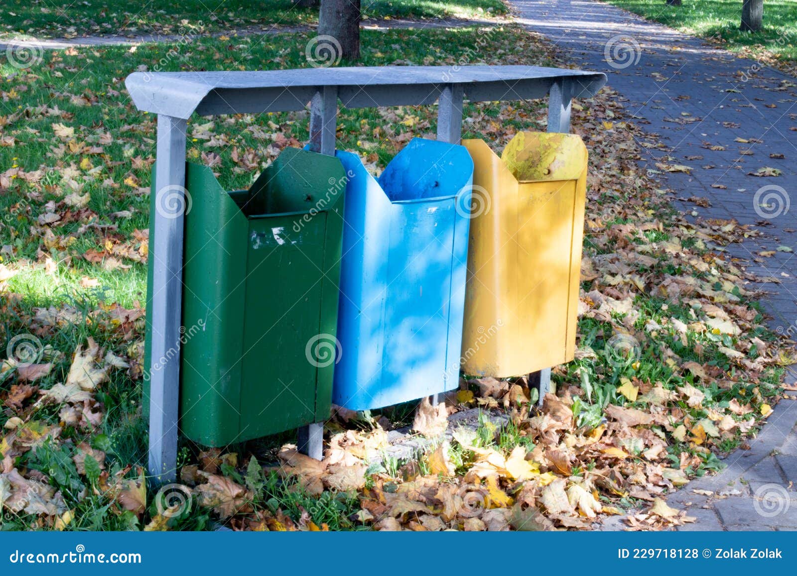 Different Colored Bins for Collection of Recycle Materials Stock Photo