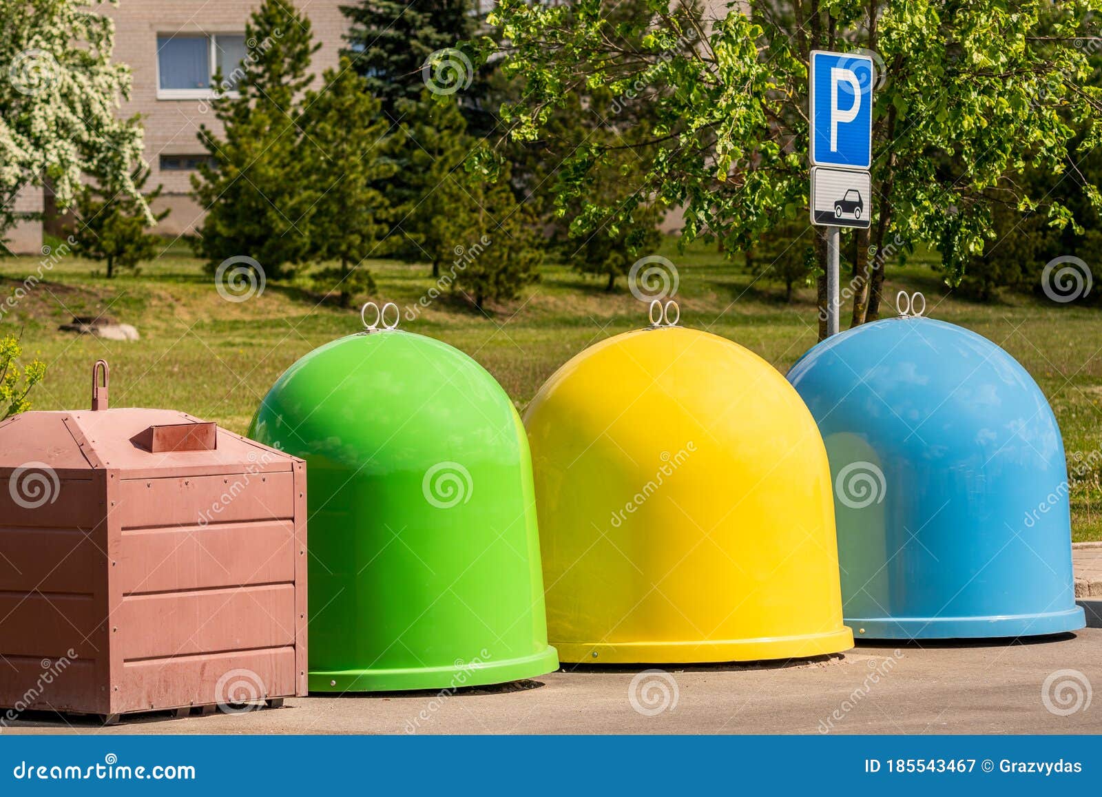 The Different Colored Bins in the Parking Lot for Collection of