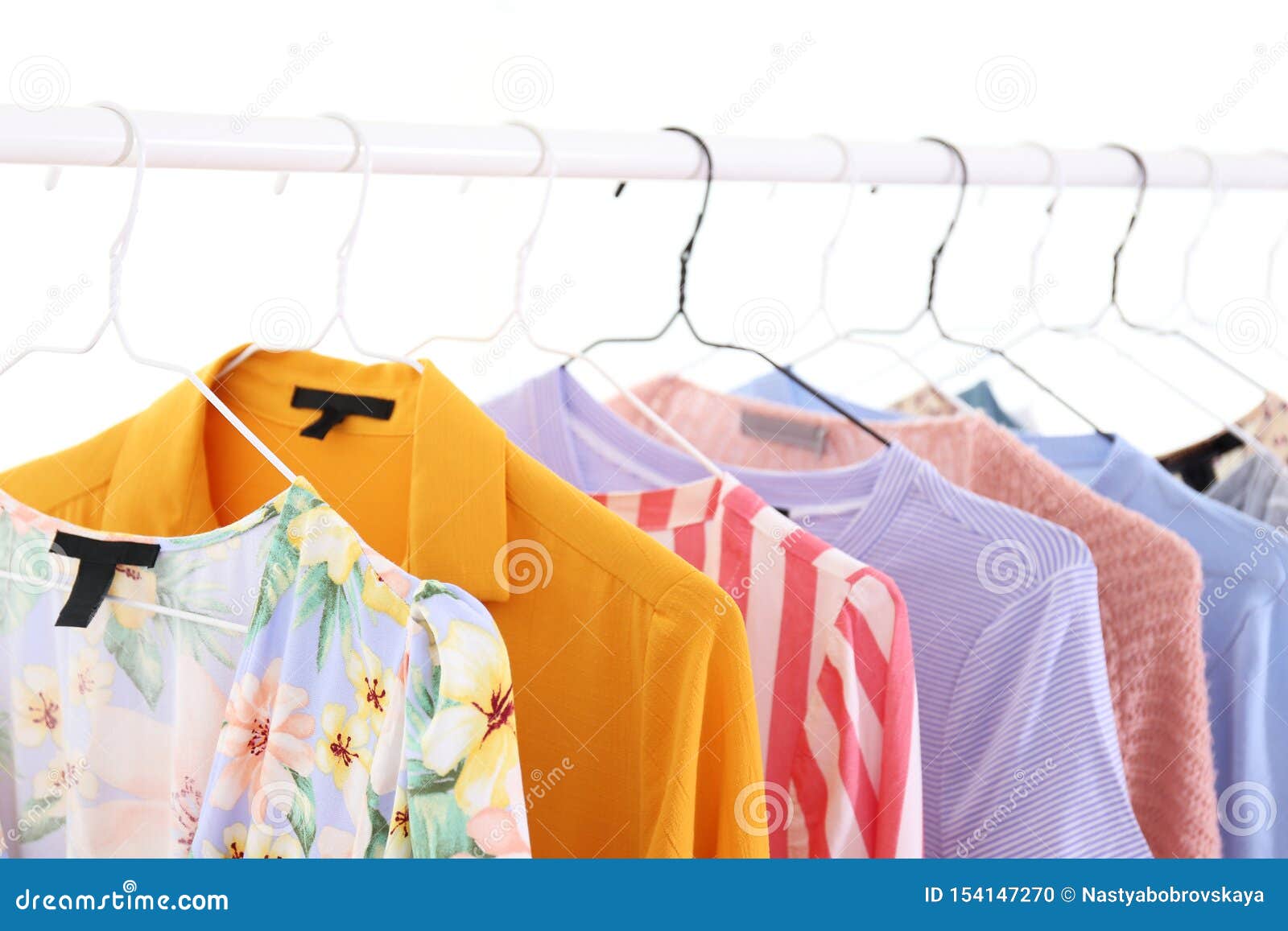Different Colorful Casual Clothing Hanging in Row Stock Photo - Image ...