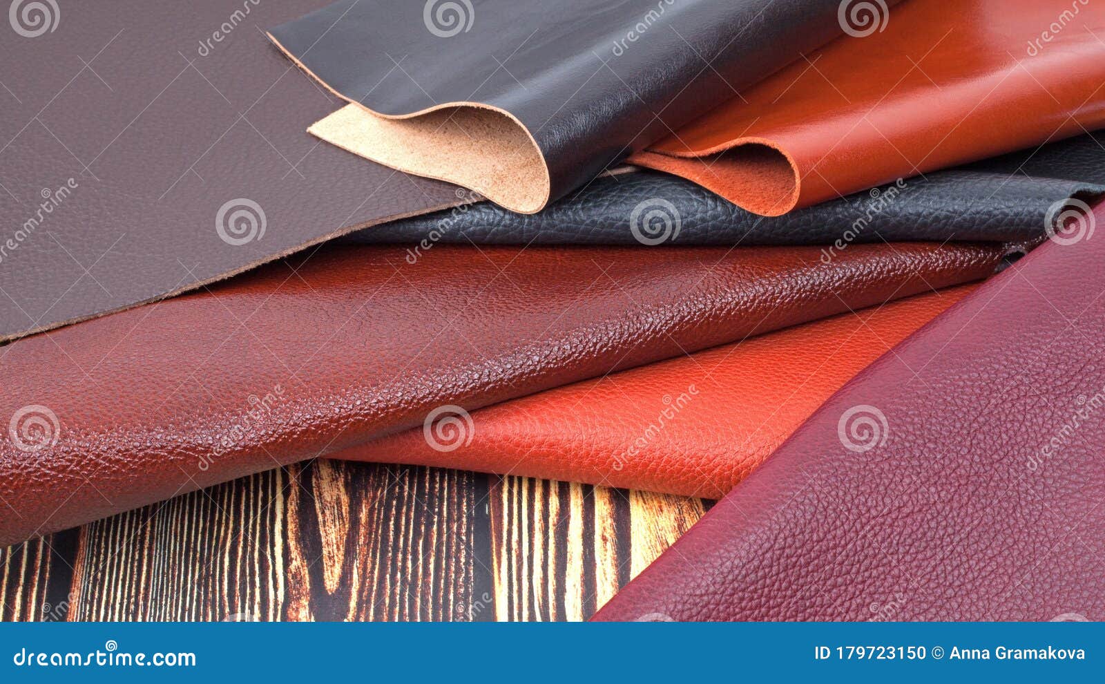 Natural Leather Textures Samples on Dark Wooden Background Stock Photo