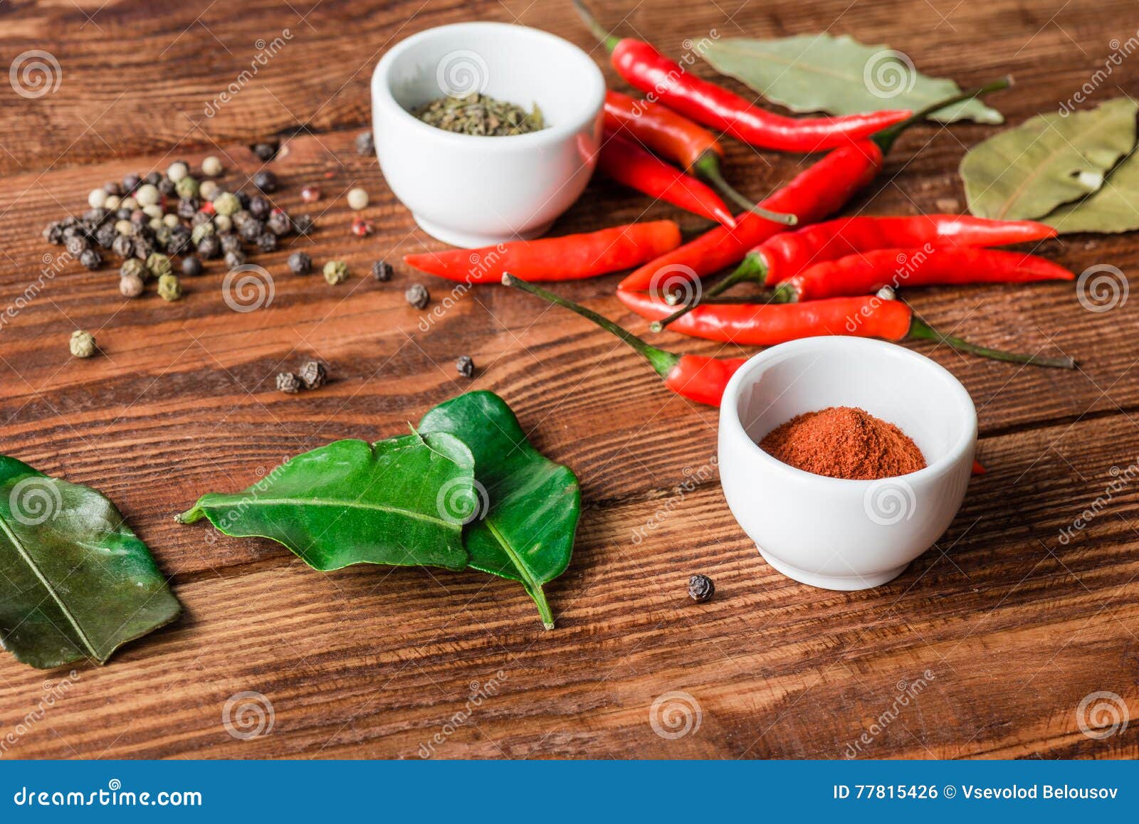 Different Condiment in Bowls or Scattered on Kitchen Table. Stock Photo