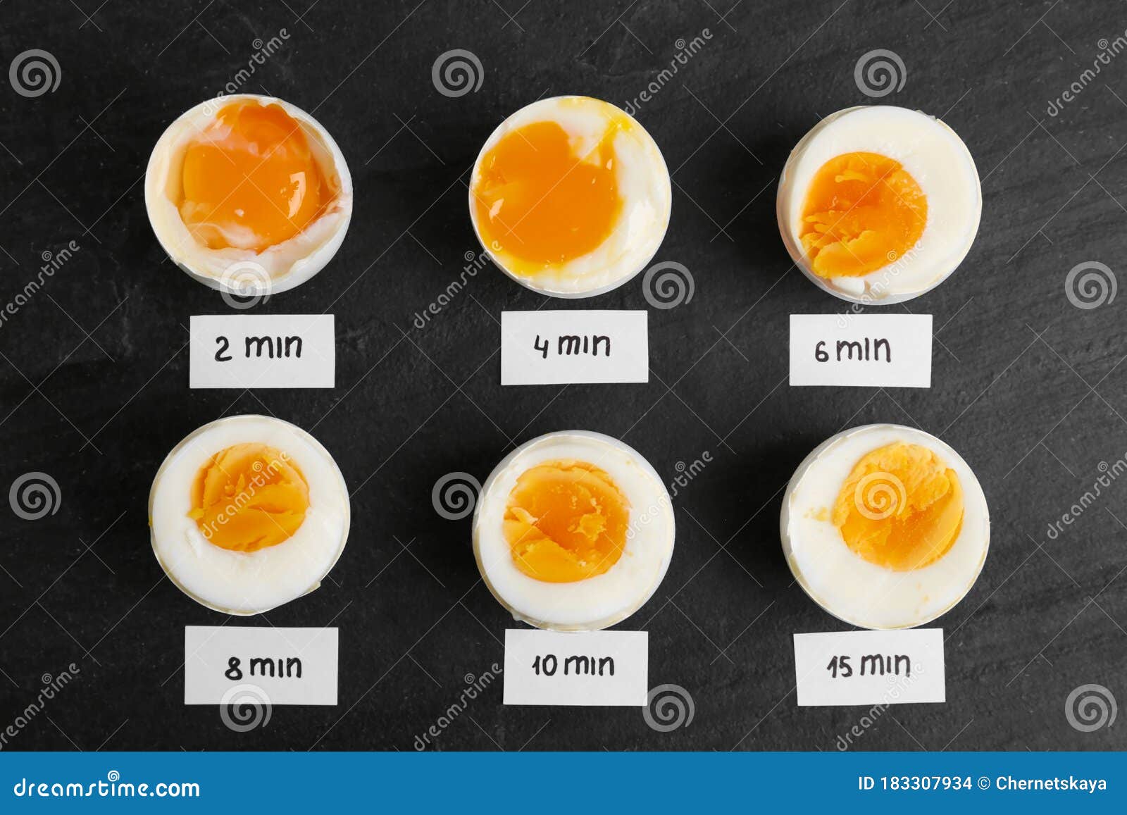 Different Cooking Time And Readiness Stages Of Boiled Chicken Eggs On Black Table Stock Photo Image Of Eggs Cooking 183307934