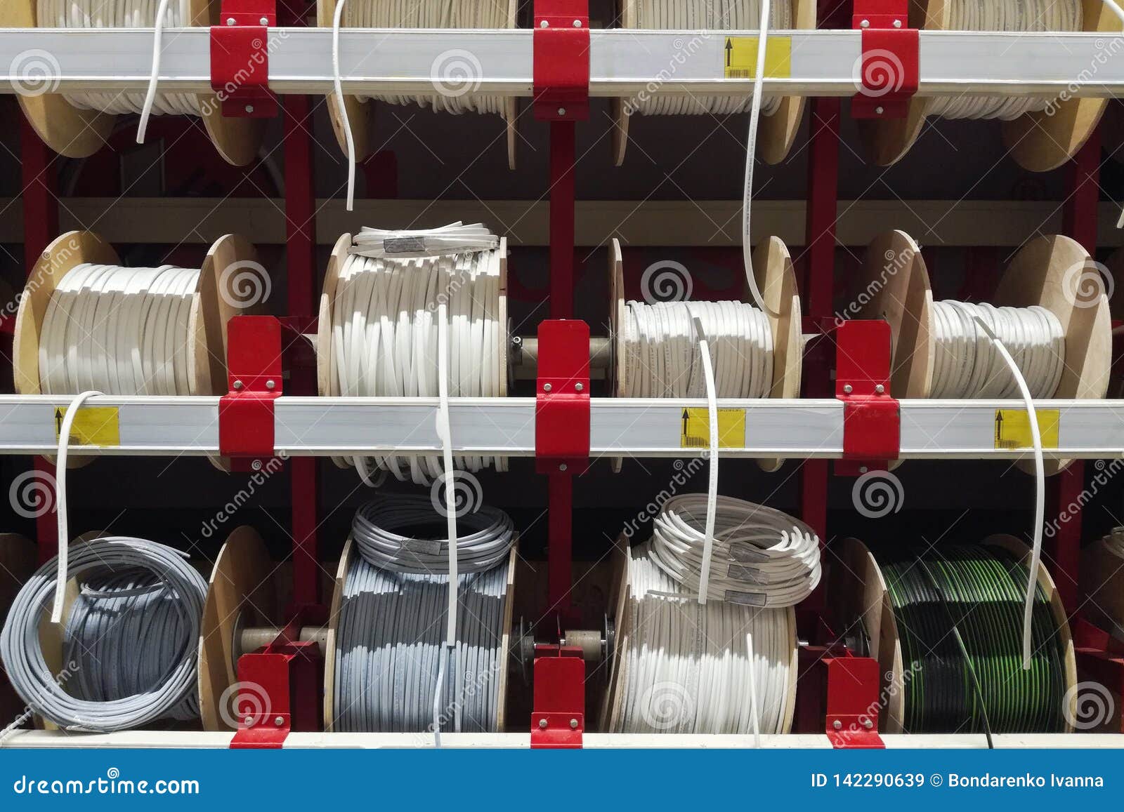 Different Electric White Cables. Wire Wound into Skeins and Rings. Electric  Wires Cable Products Samples in Store Stock Image - Image of industry,  cabling: 142290639