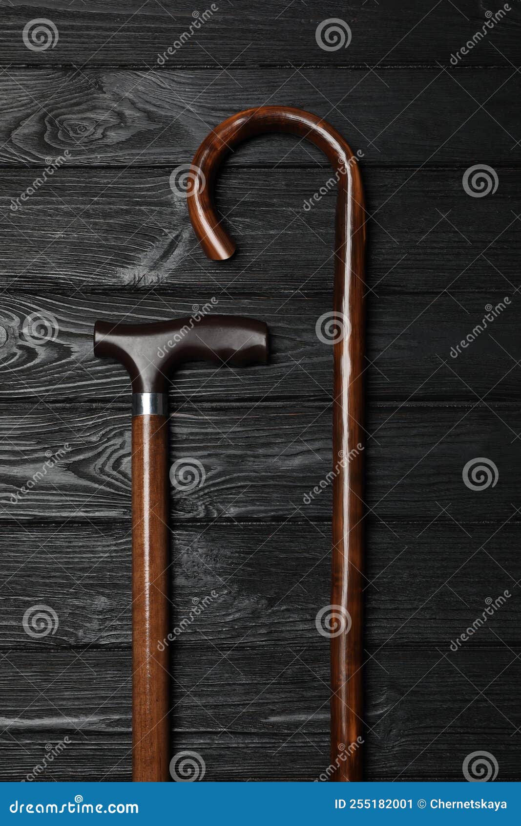 Different Elegant Walking Canes on Wooden Table, Flat Lay Stock Image