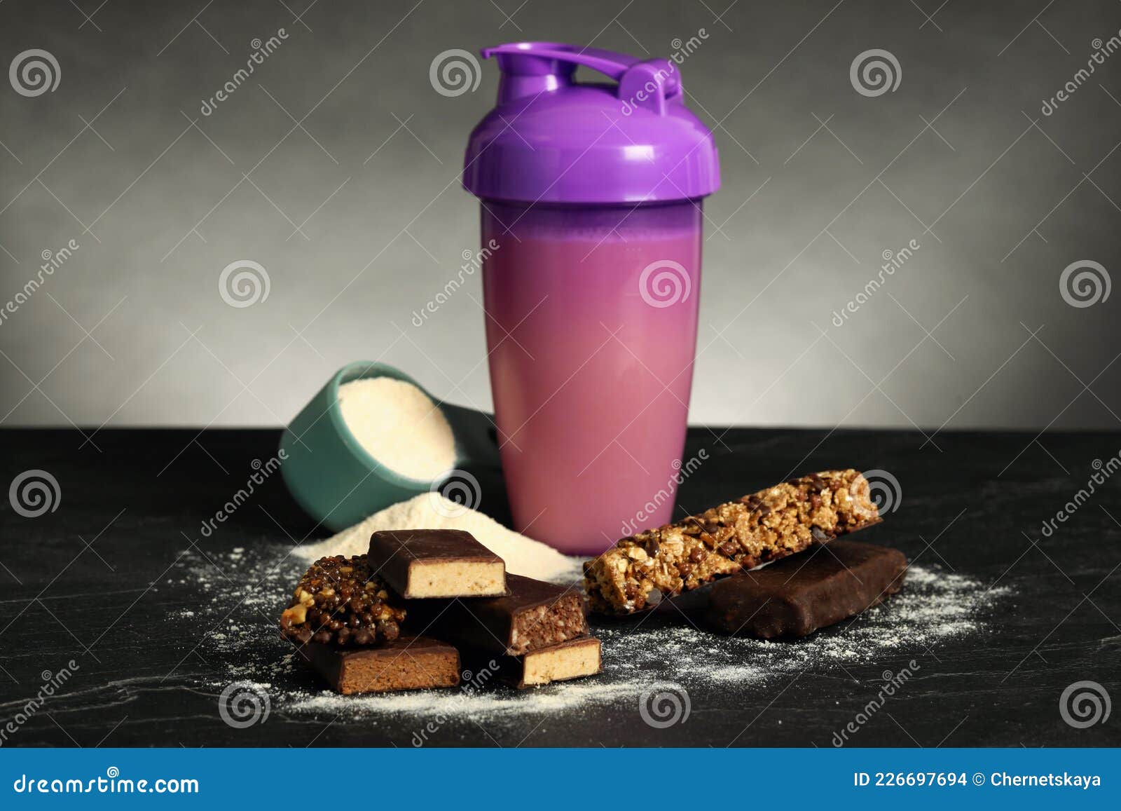 Different Energy Bars, Protein Cocktail and Powder on Black Table Stock