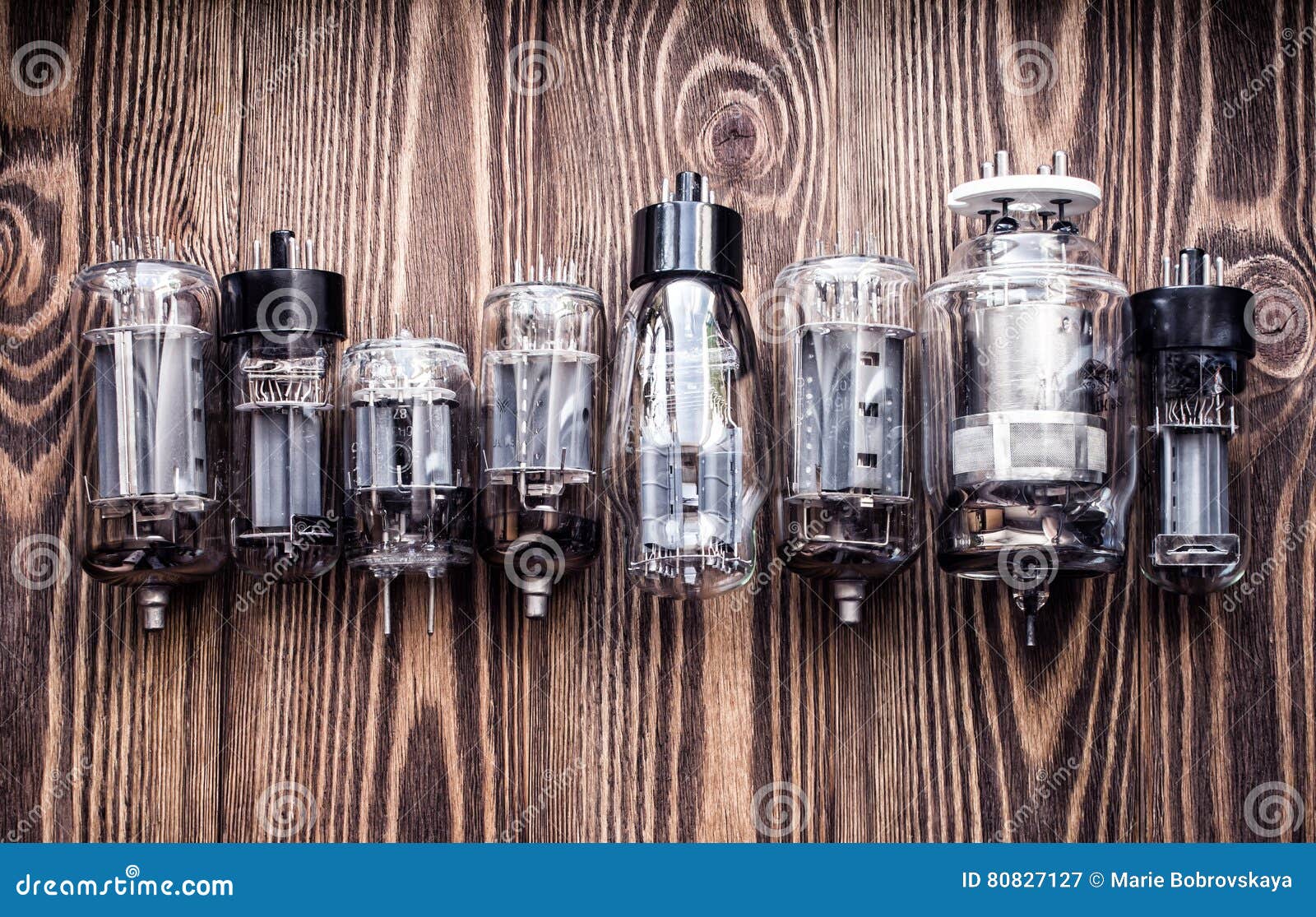 Different Generations of Electronic Vacuum Tubes. Closeup View. Stock