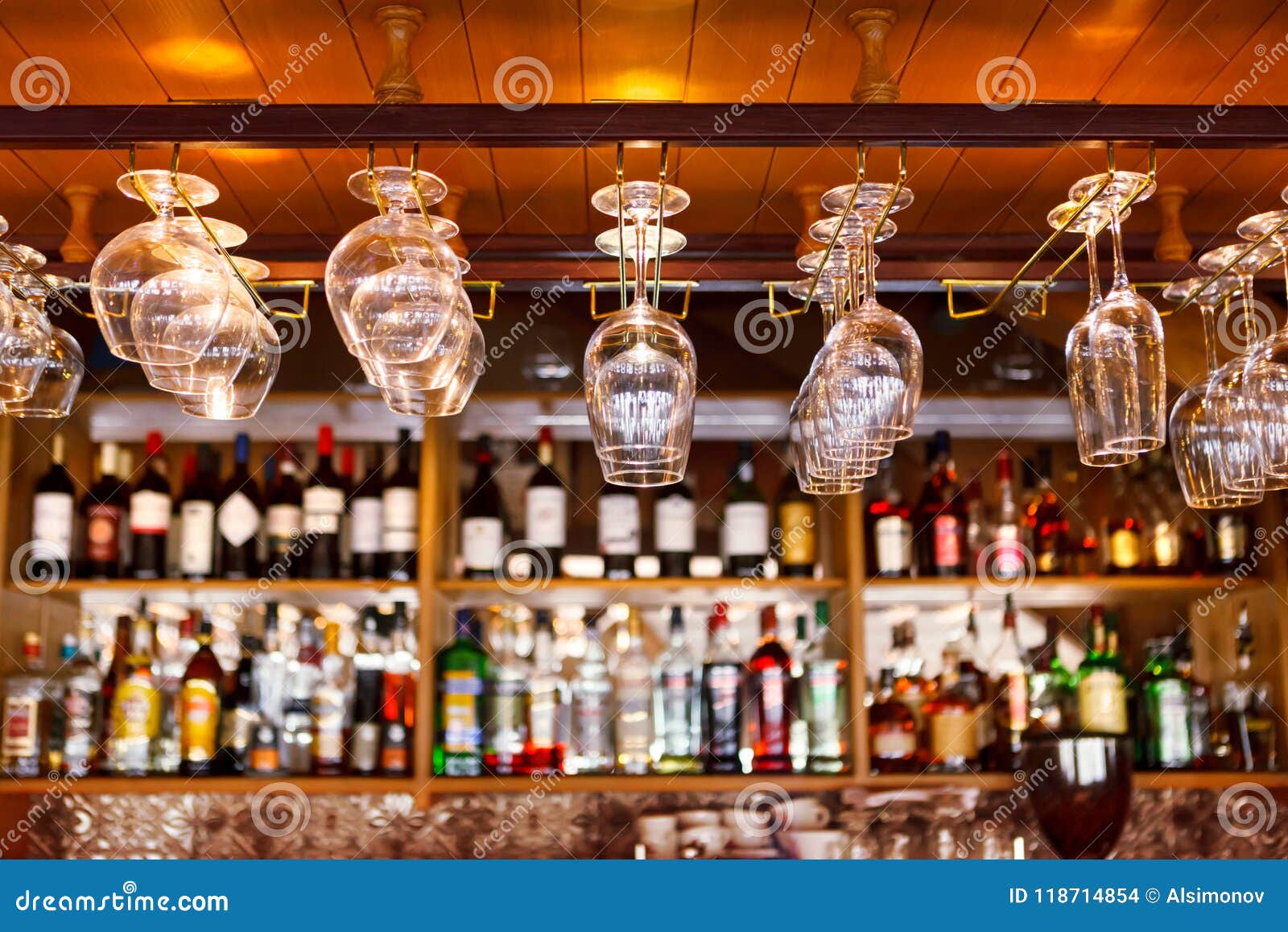 Different Glasses Hanging Over the Bar. Soft Focus Stock Photo Image