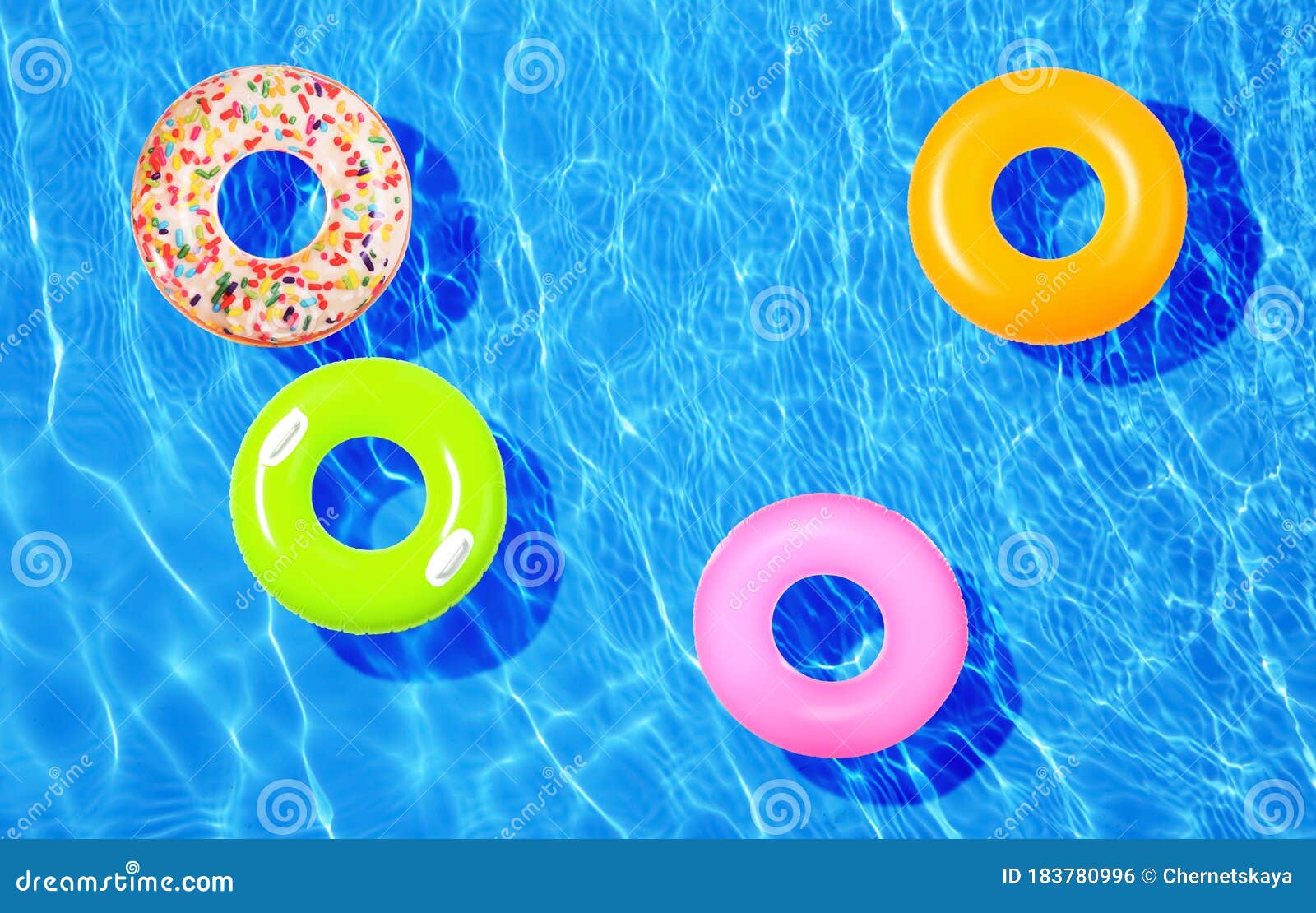 Different Inflatable Rings Floating in Swimming Pool Stock Photo ...