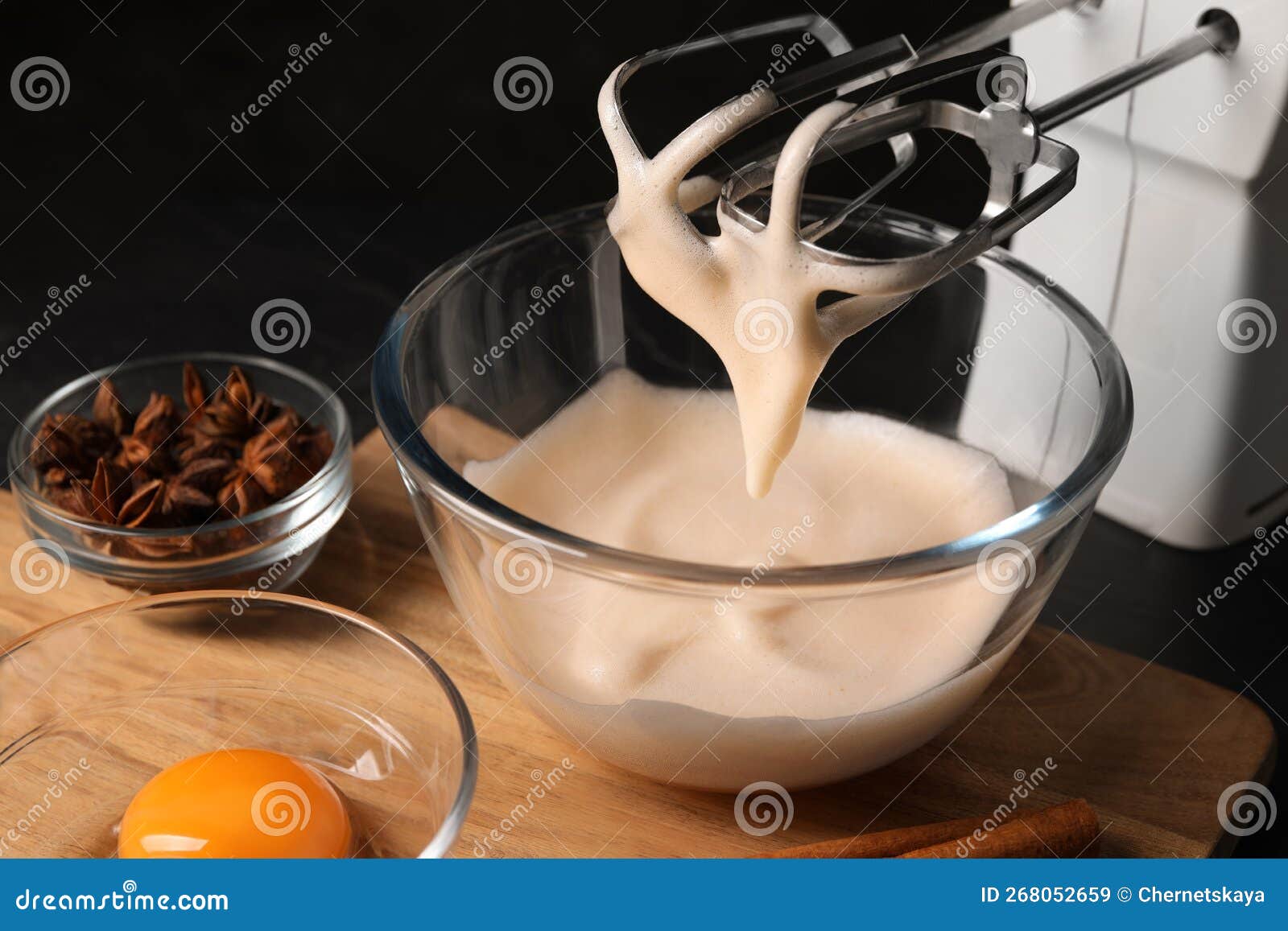Different Ingredients and Mixer on Black Table. Cooking Delicious