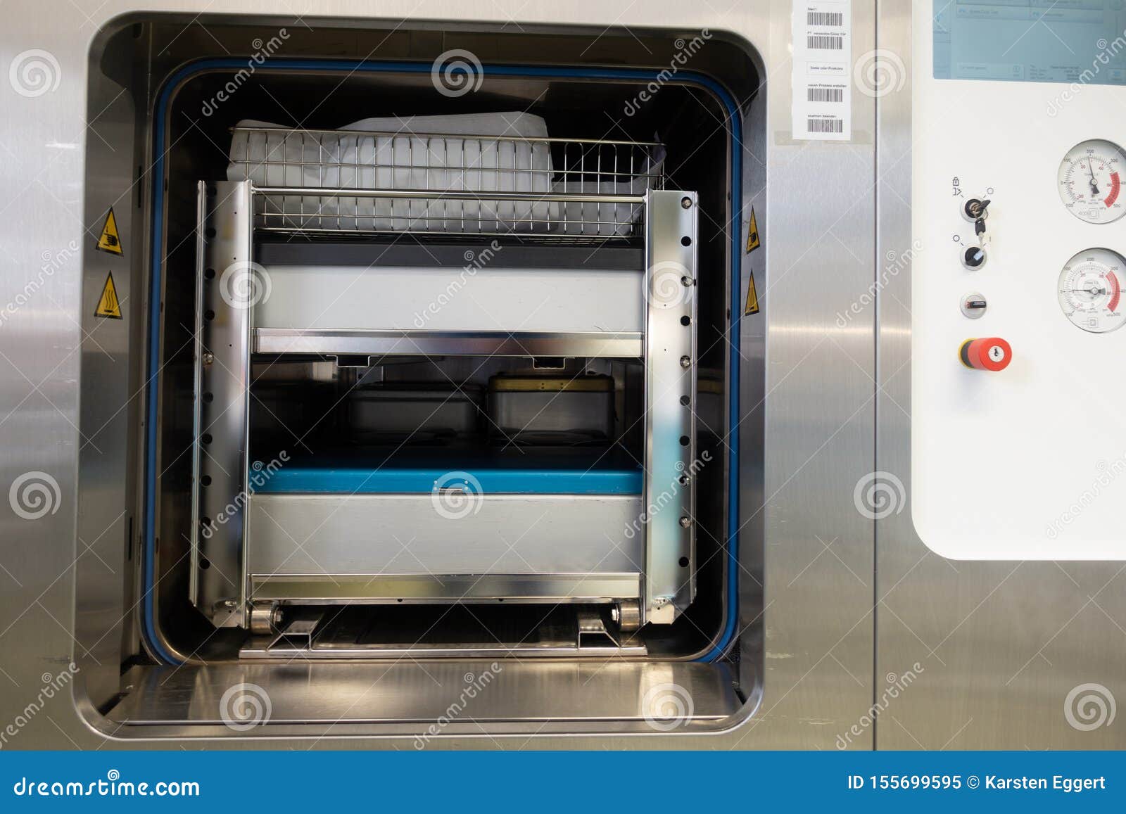 Different Instrument Containers are Pushed into a Sterilization Unit