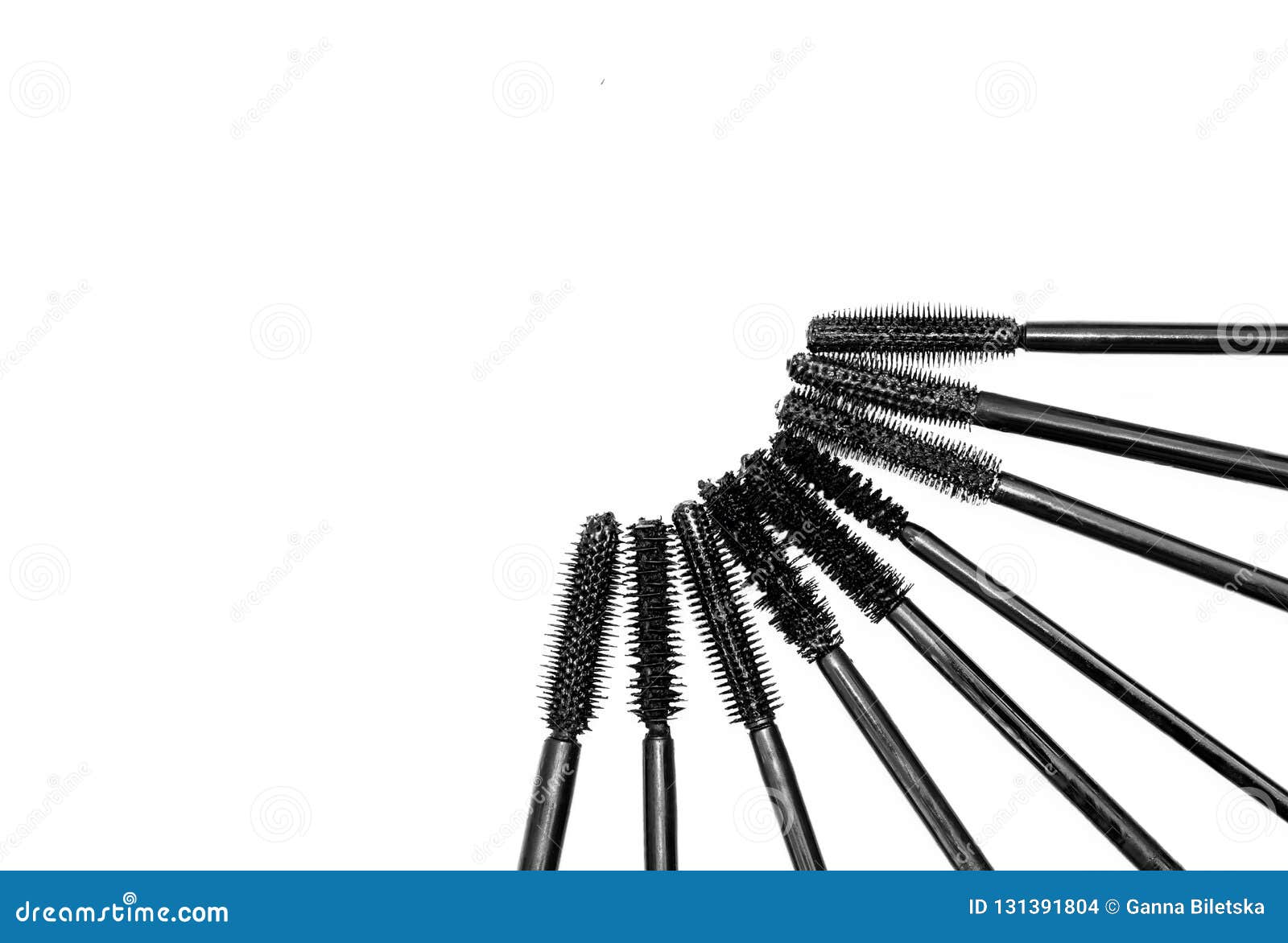 Row Of Different Mascara Brushes On A White Background. Stock Photo