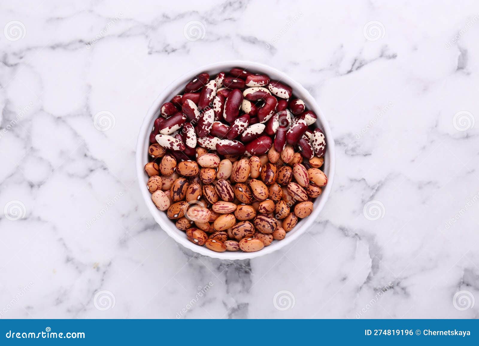 Different Kinds of Dry Kidney Beans in Bowl on White Marble Table, Top