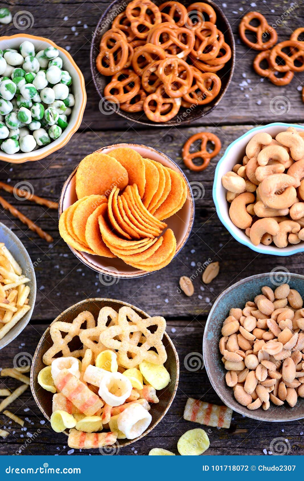 Different Kinds of Snacks - Chips, Salted Peanuts, Cashews, Peas with  Wasabi, Pretzels with Salt, Potatoes, Salted Straw. Stock Photo - Image of  potatoes, stick: 101718072
