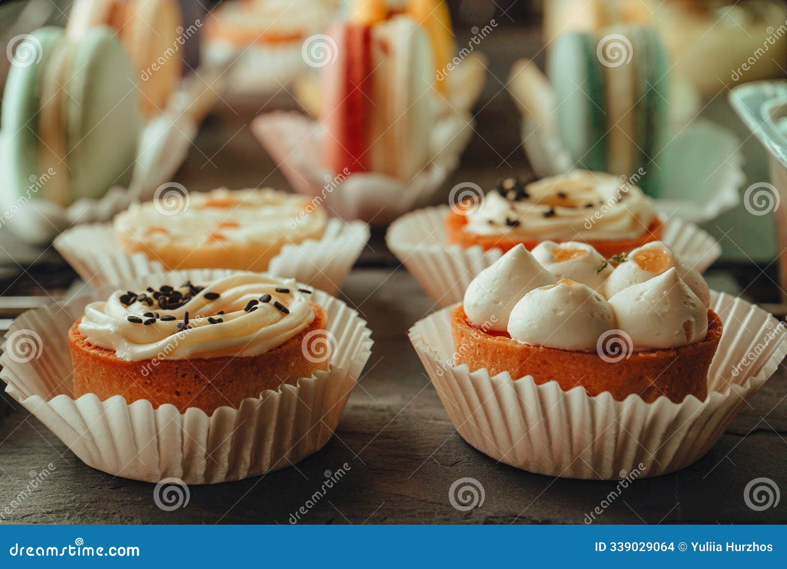 different kinds of tarts at cafes or coffeeshops. display case with sweets. close up photo of tarts and macaroons at the