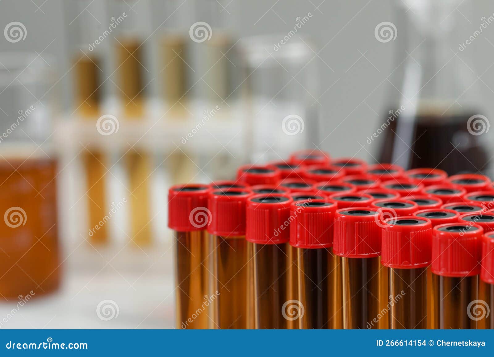 Different Laboratory Glassware with Brown Liquids, Closeup. Space for