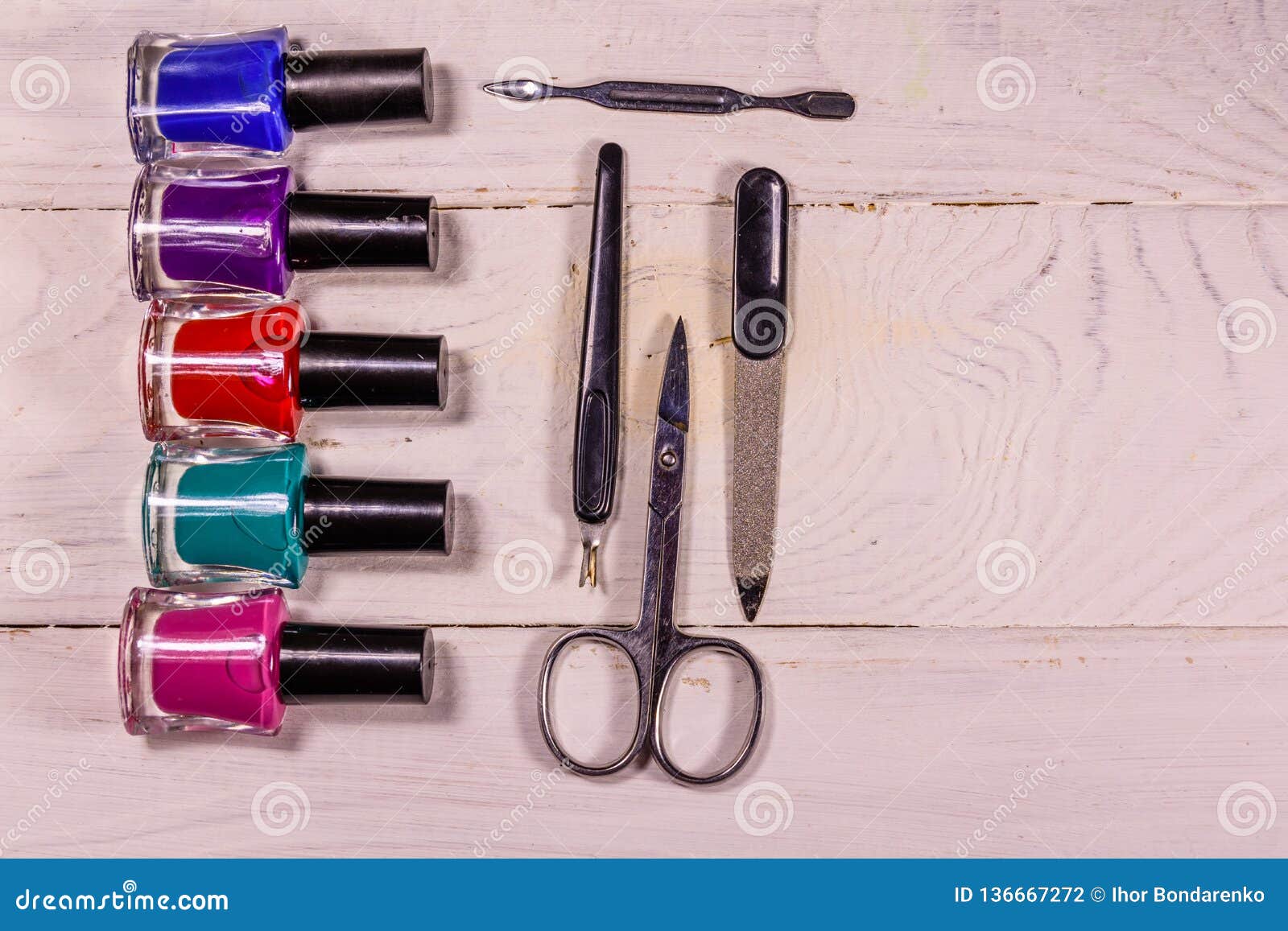 Different Manicure Tools and Nail Polishes on Wooden Table. Top View