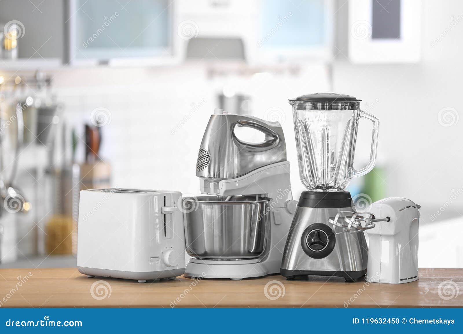 Different Modern Kitchen Appliances on Table Indoors Stock Photo