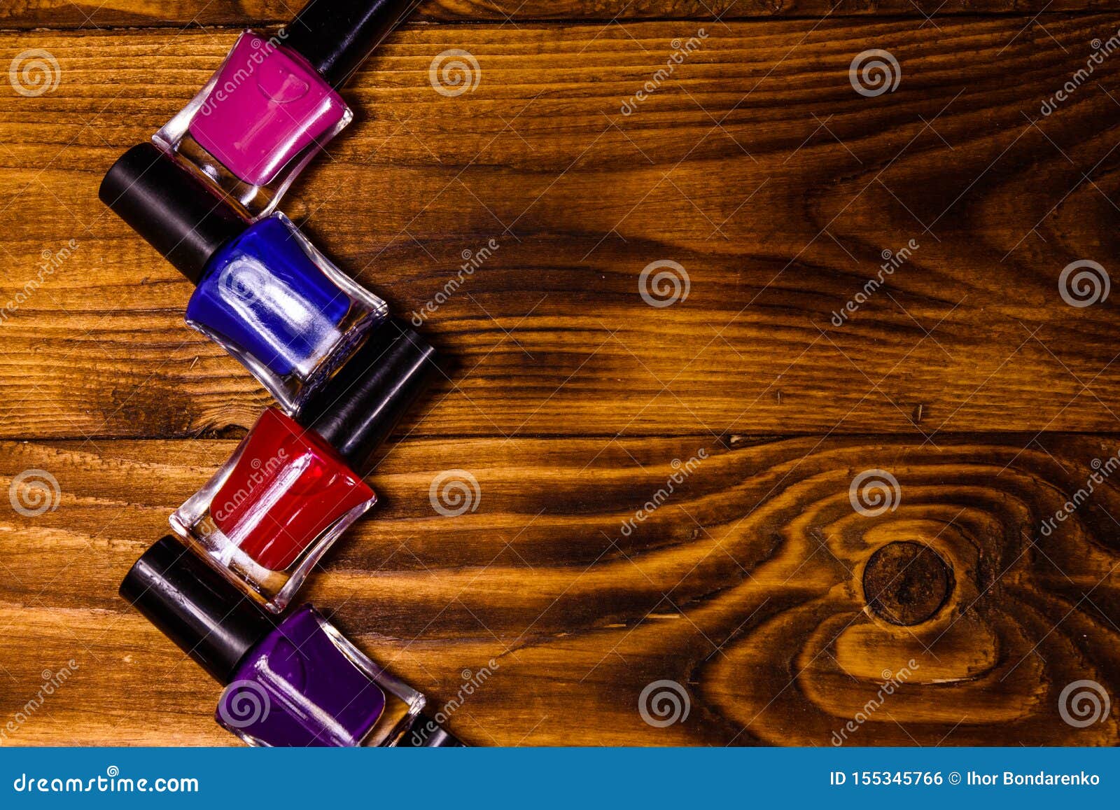 Different Nail Polishes on a Wooden Table. Top View Stock Photo Image