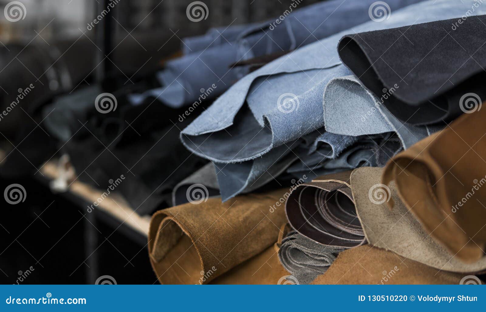 Different Pieces of Leather in a Rolls. the Pieces of the Colored Leathers. Rolls of Blue and