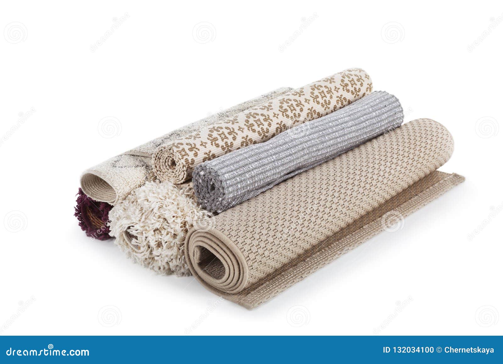 different rolled carpets on white background