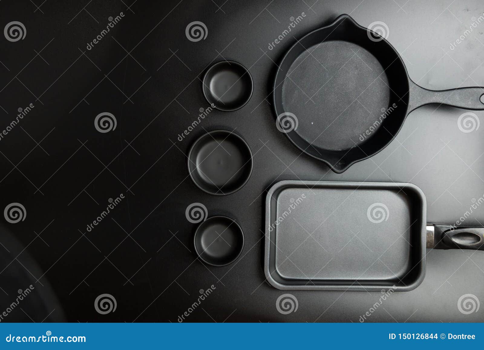 Different Sizes Black Cook Pan and Black Different Sizes Bowl Stock