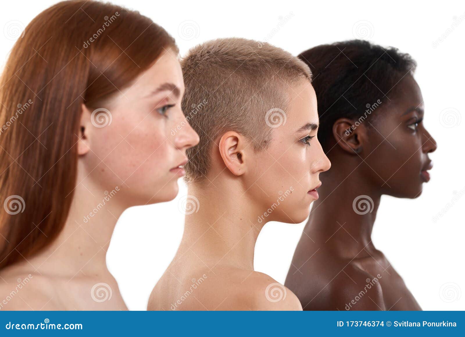 different skin tones. side view of three beautiful multicultural young women.two caucasian and african half naked women