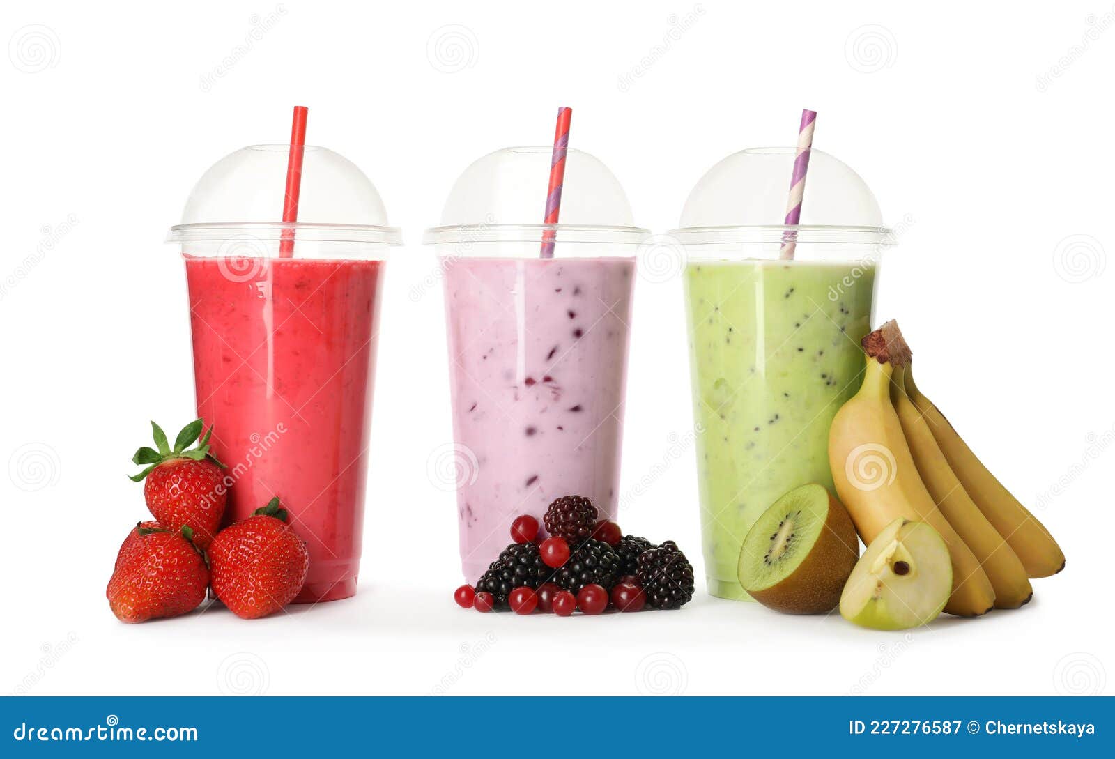 Different Smoothies with Straws in Plastic Cups and Fresh Fruits