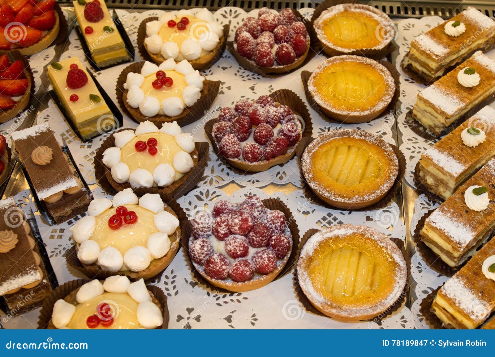 Different Sort of Beautiful Pastry, Small Colorful Sweet Cakes Stock