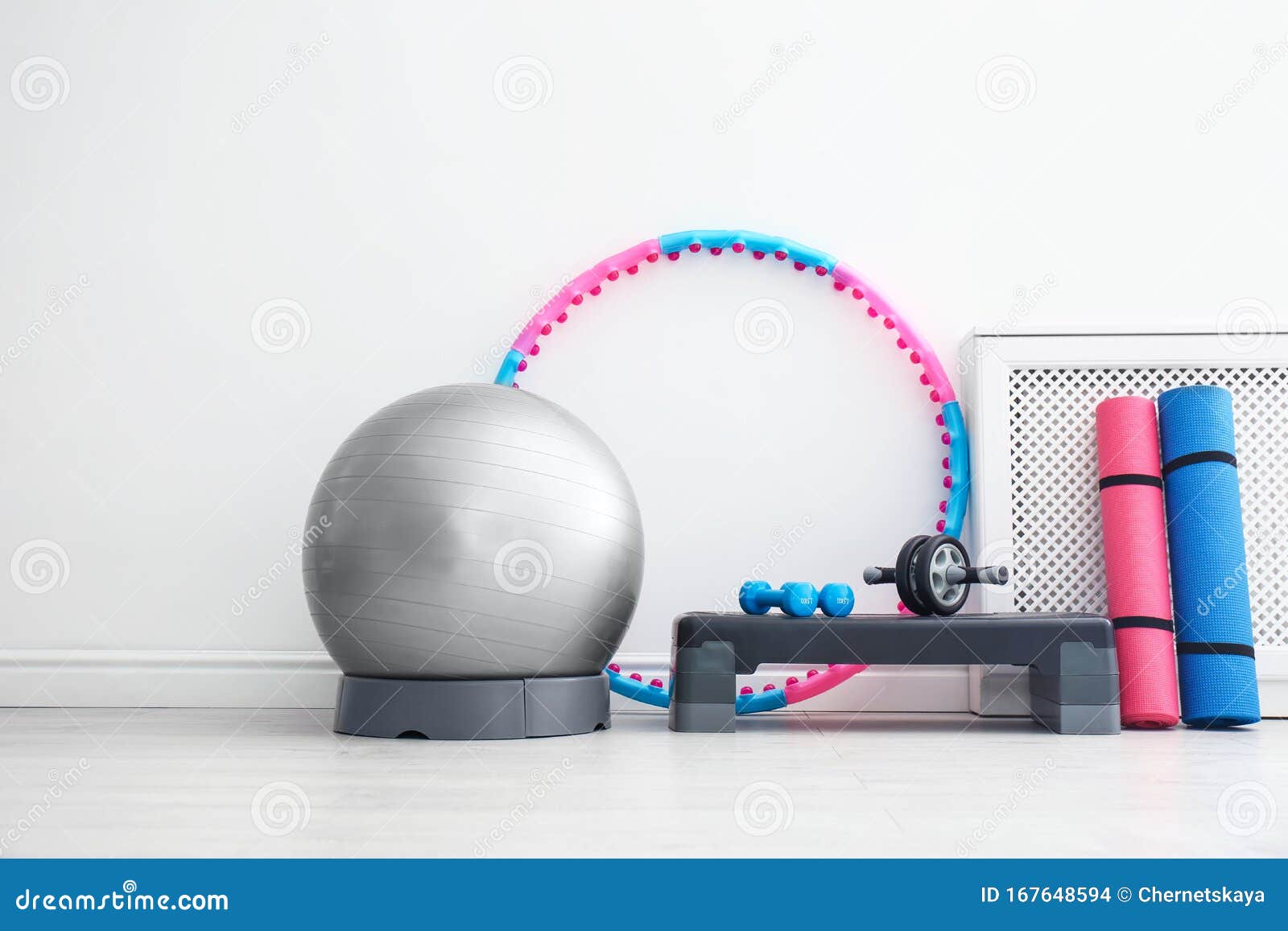 Different Sports Equipment Near Wall In Gym Stock Photo - Image of mats, items: 167648594