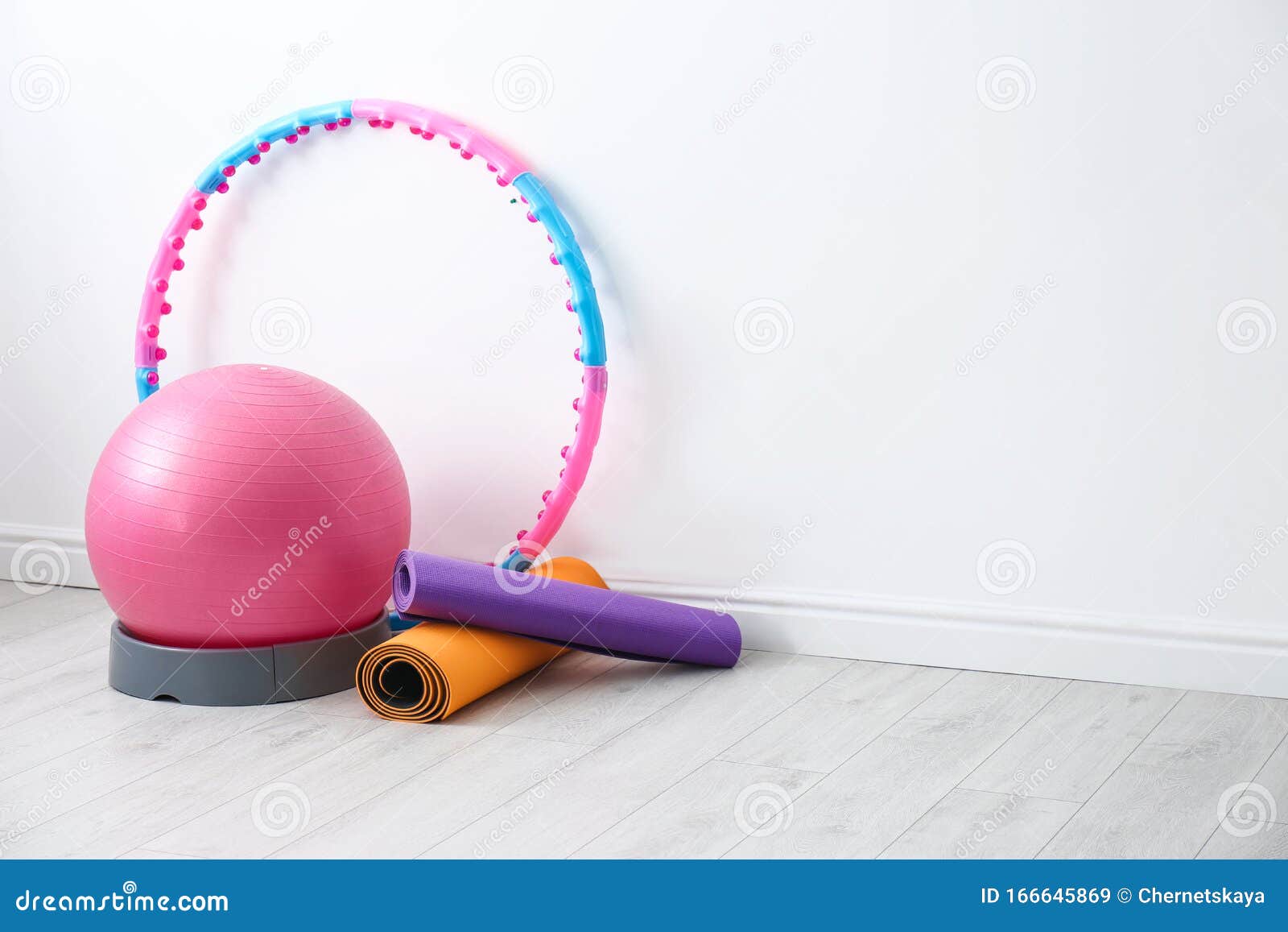 Different Sports Equipment Near White Wall In Gym Stock Image - Image of white, gymnastic: 166645869