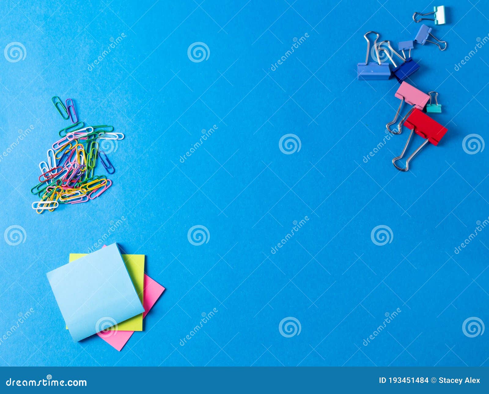 different stationary items  on the blue background. minimalism. flat lay