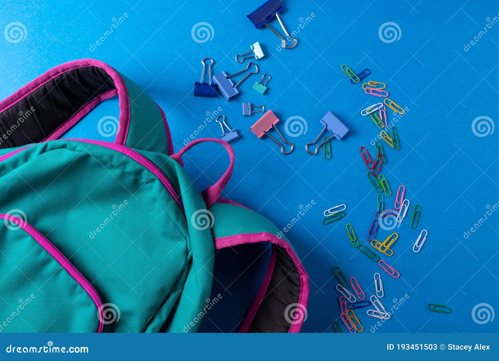 different stationary items  on the blue background. minimalism. flat lay