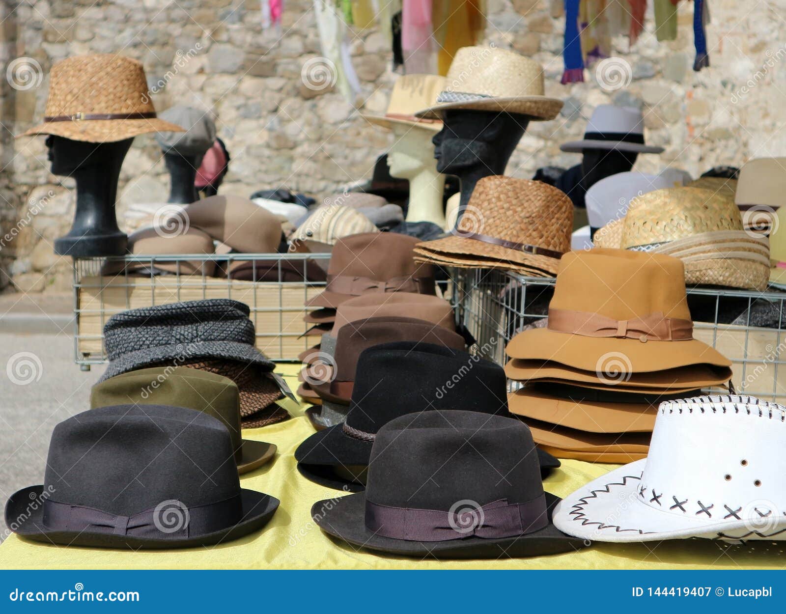 Different Style Men Hats on a Shelf of a Street Market. on Background,  Manikin Heads Wearing Straw Hats Stock Image - Image of cowboy, brown:  144419407