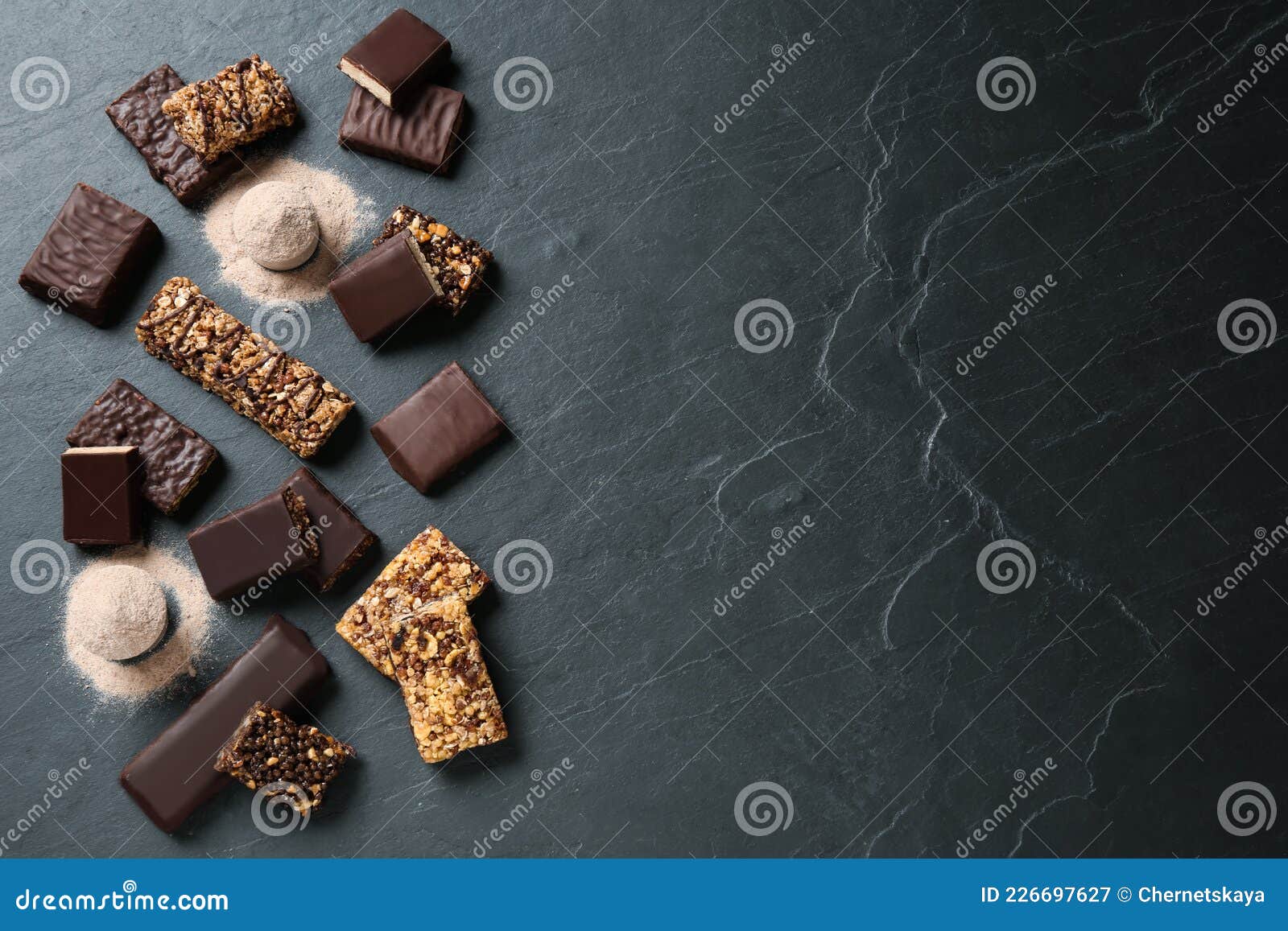 Different Tasty Energy Bars and Protein Powder on Black Table, Flat Lay