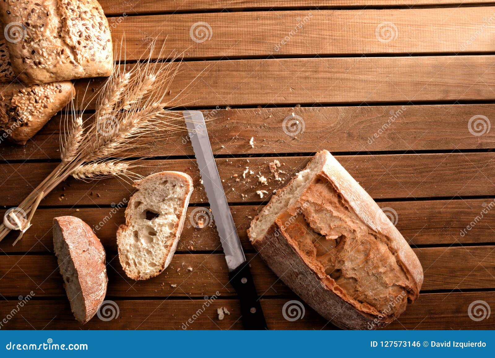 Different Types Of Bread On Rustic Wooden Table Top Dark Stock Photo