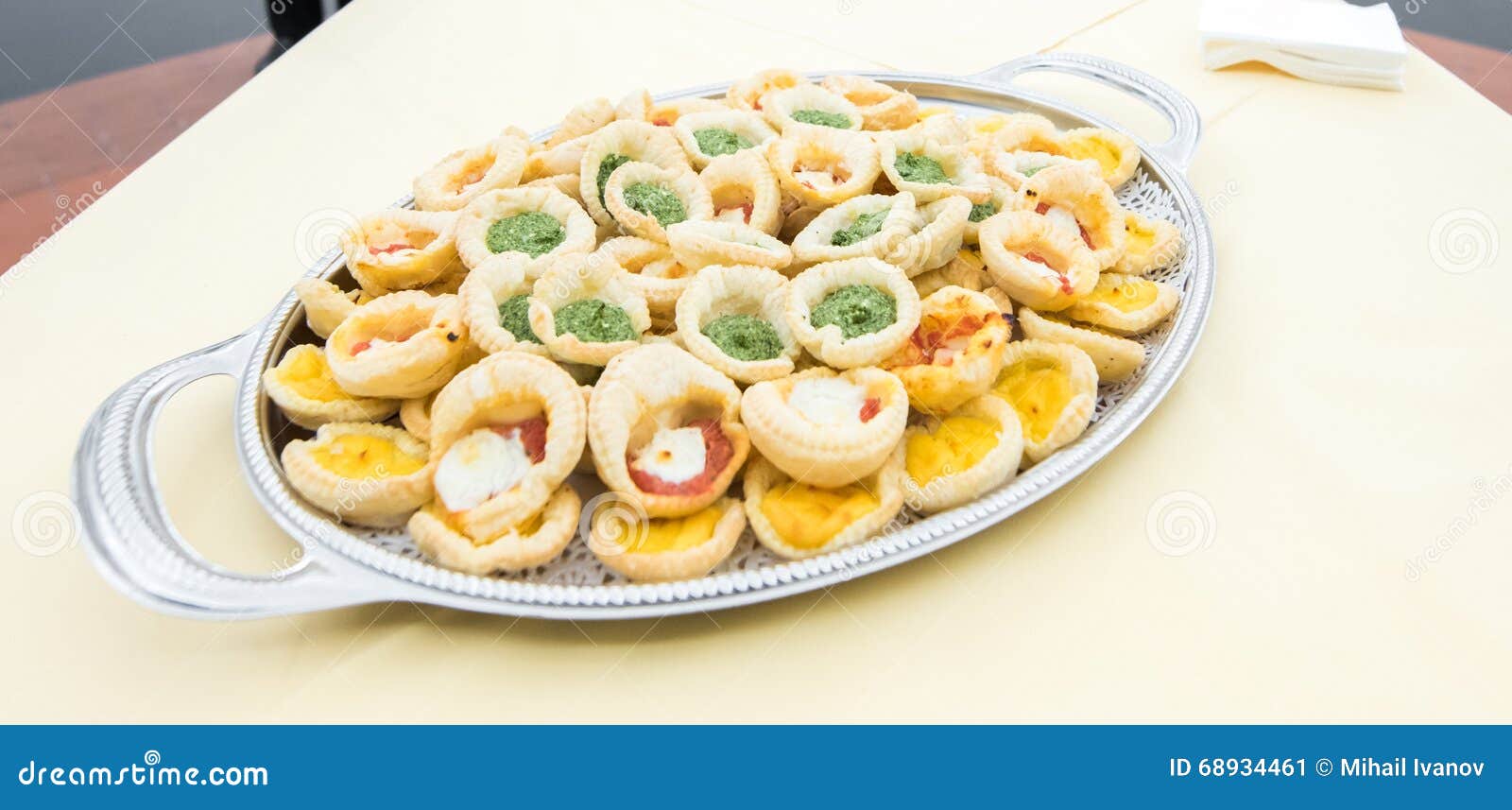 Different Types of Buns with Mozzarella, Pesto and Eggs on a Tray Stock