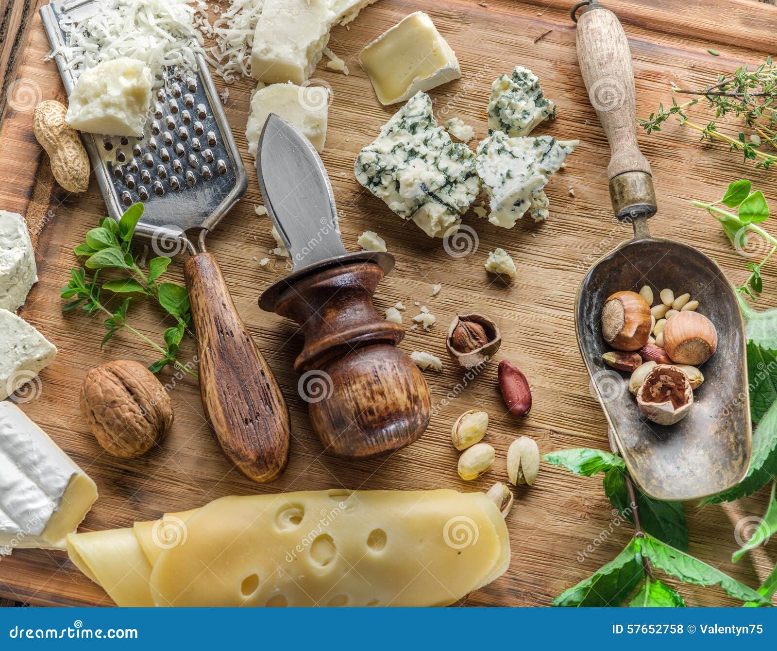 Different Types of Cheeses with Nuts and Herbs. Stock Photo Image of